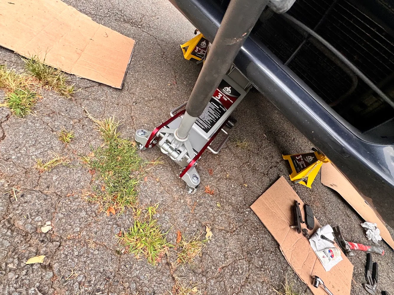 Honda Accord supported on Jack Boss jack stands during front brake work