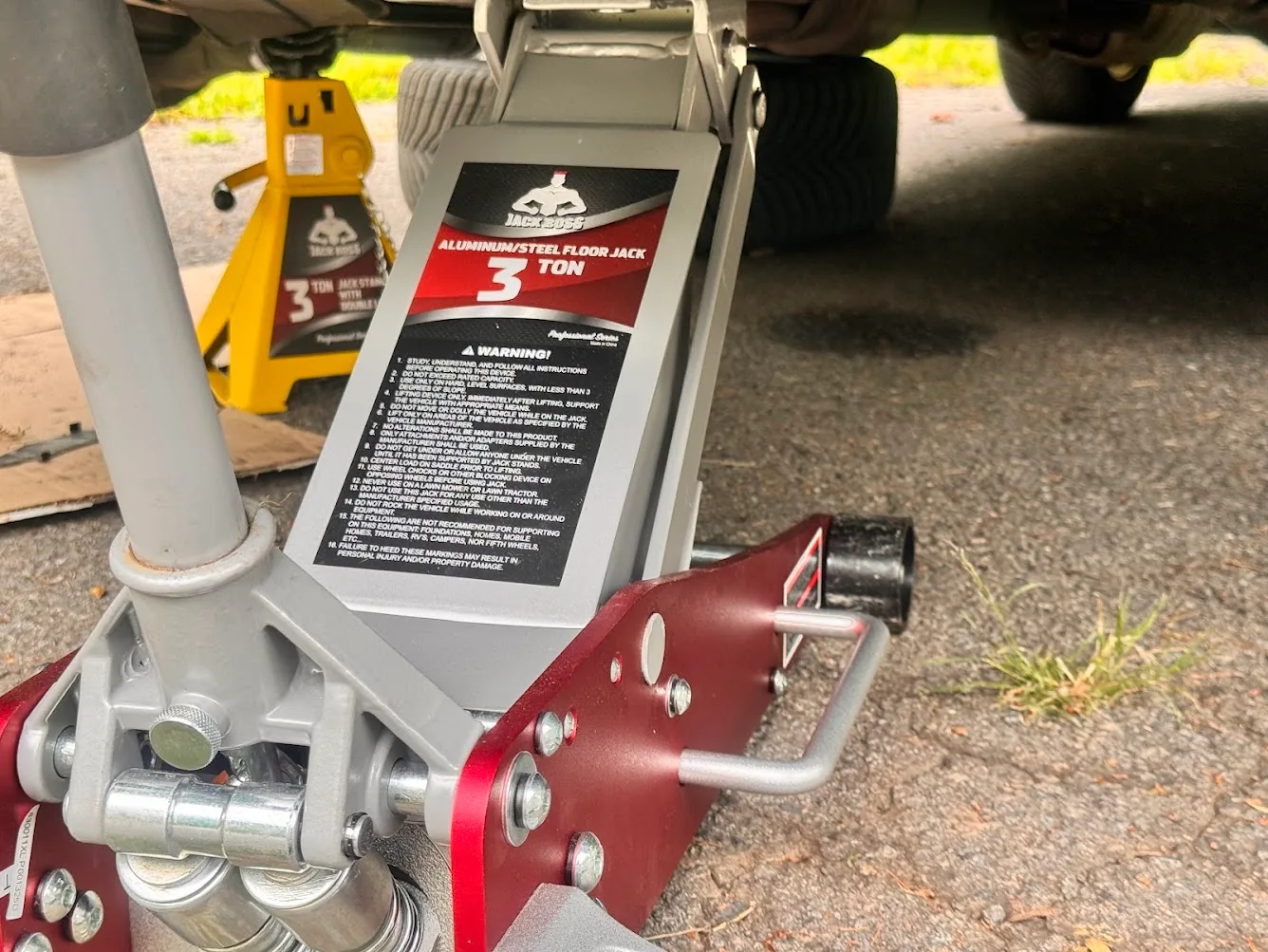Jack Boss 3-ton low-profile floor jack under a Honda Accord