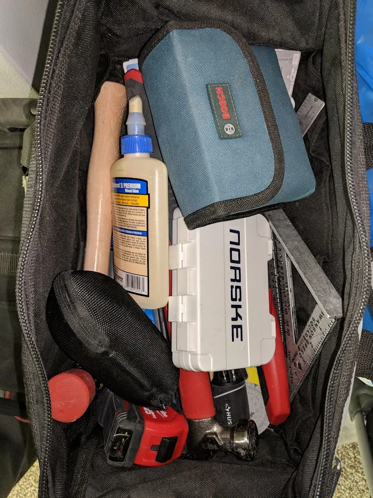 Bosch laser storage pouch inside a working carpenter tool bag