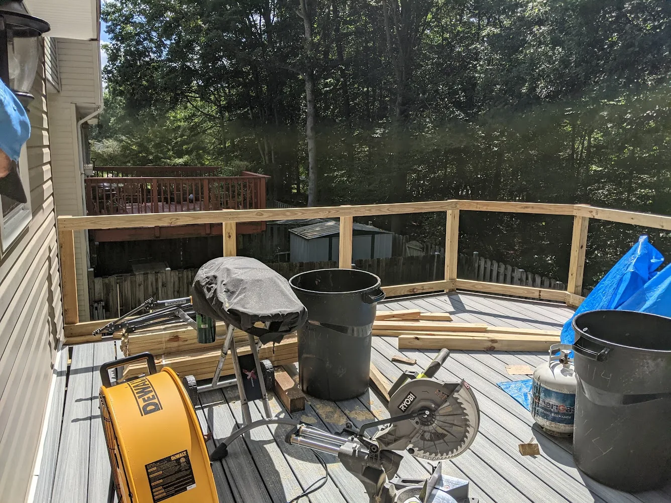 DEWALT high-velocity fan beside the RYOBI miter saw on the deck