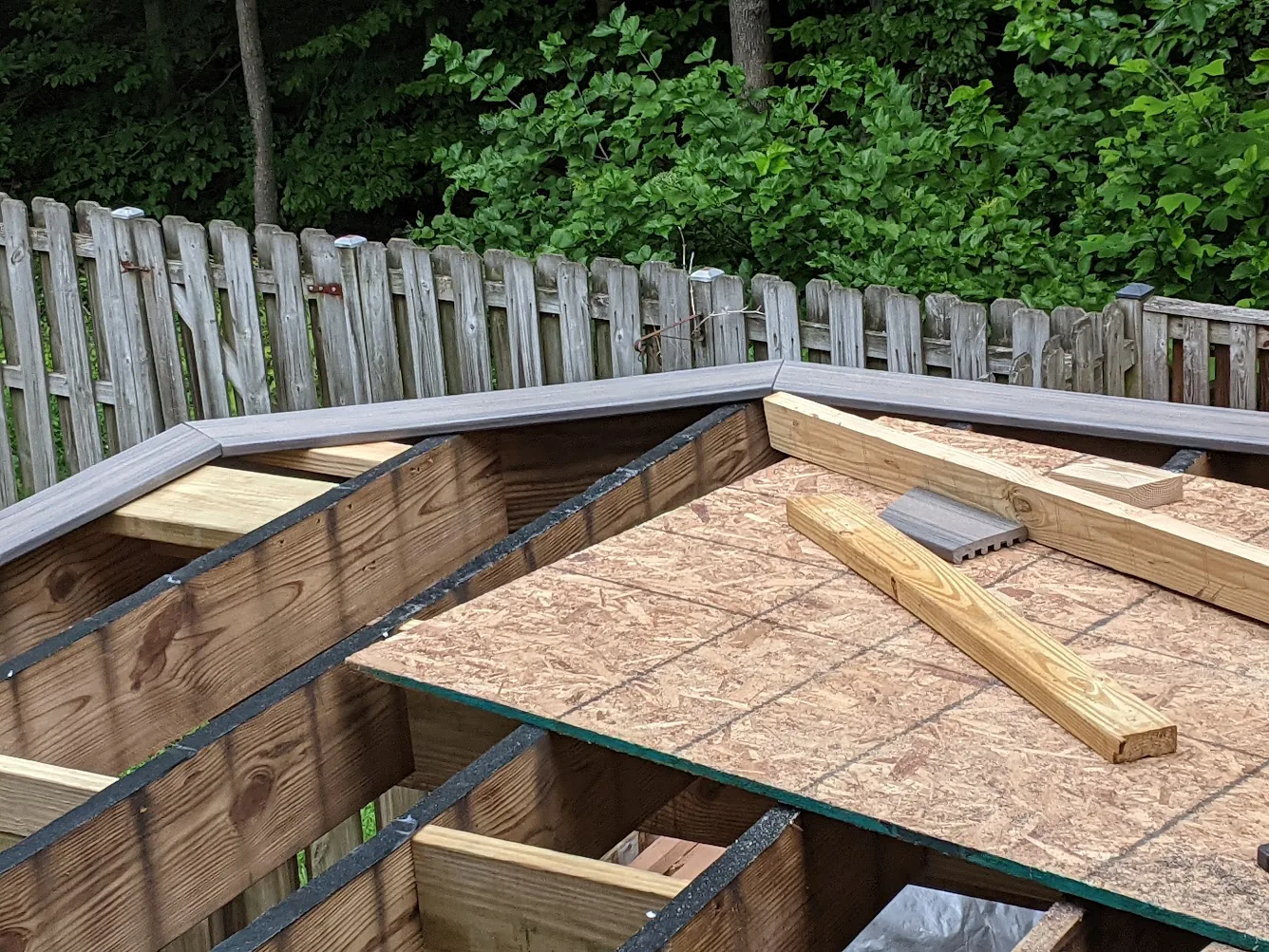 Deck joists with protective tape applied along the top edges