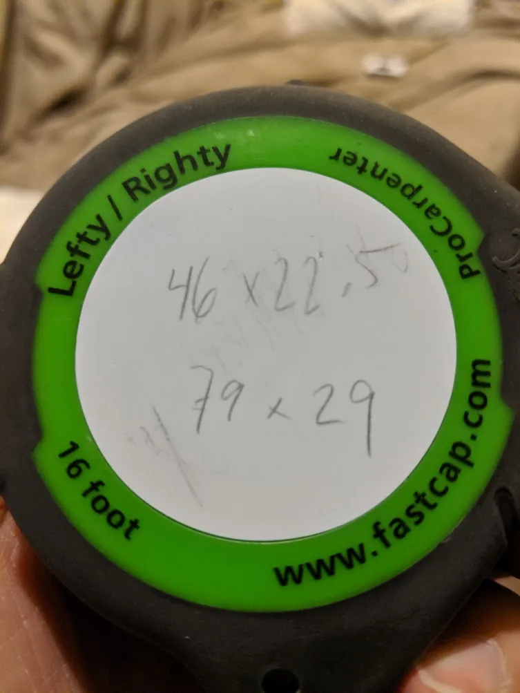 Side view of a well-used FastCap tape measure