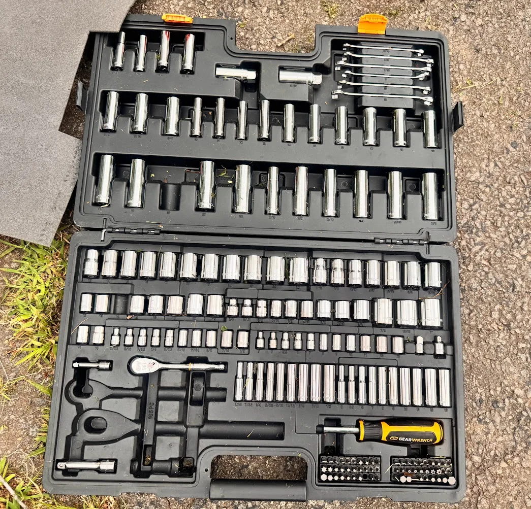 Our GEARWRENCH 185-piece mechanics tool set opened outdoors showing sockets, ratchets, wrenches and bits
