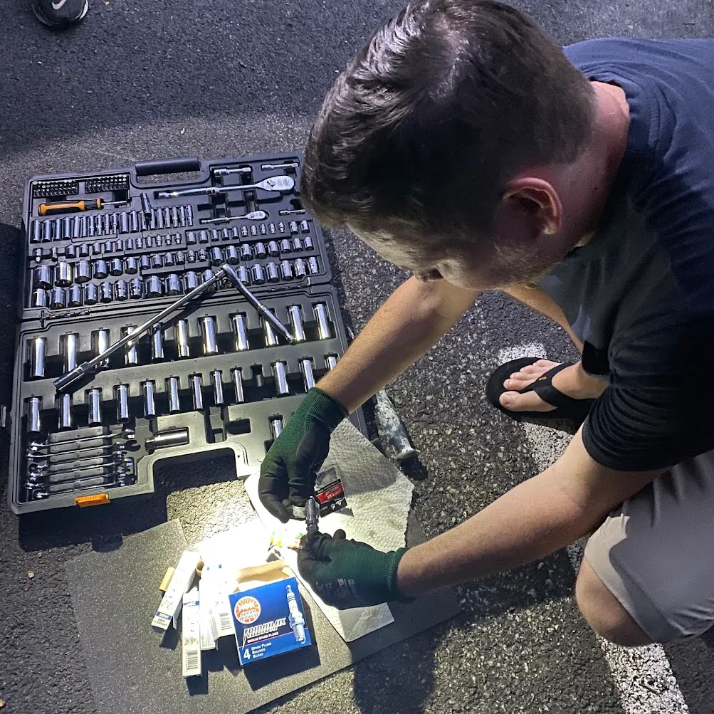 GEARWRENCH mechanics tool set being used during a spark-plug replacement