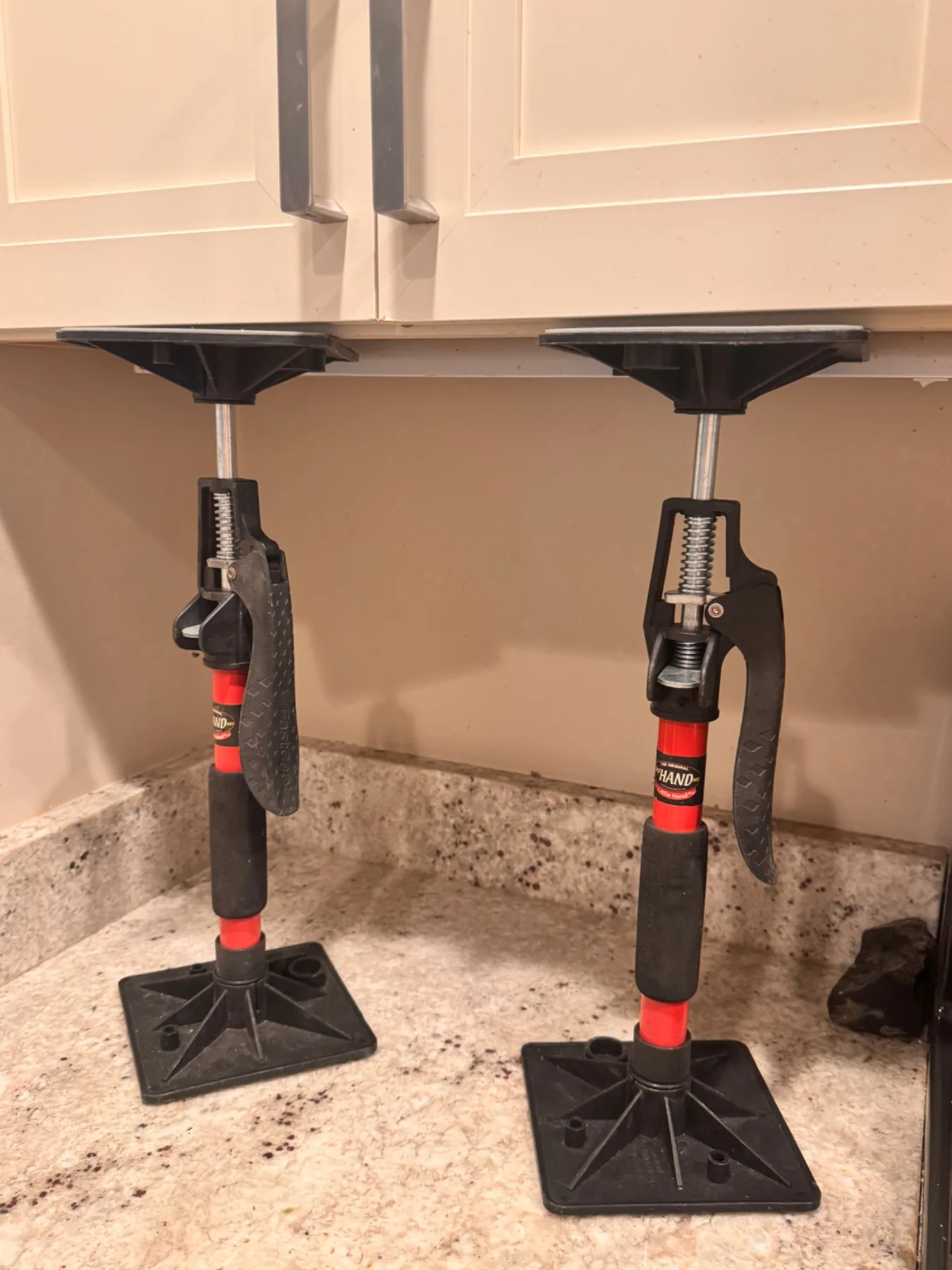 Two Little Hand supports positioned under upper cabinets