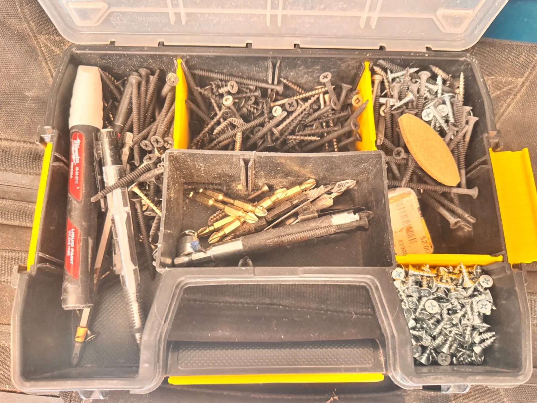 Close view of screws, bits and markers inside the SortMaster